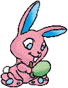 A rabbit painting an egg